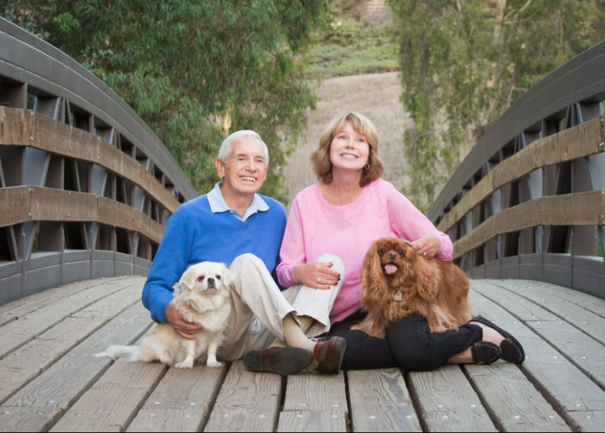 Jans and husband photo with dogs